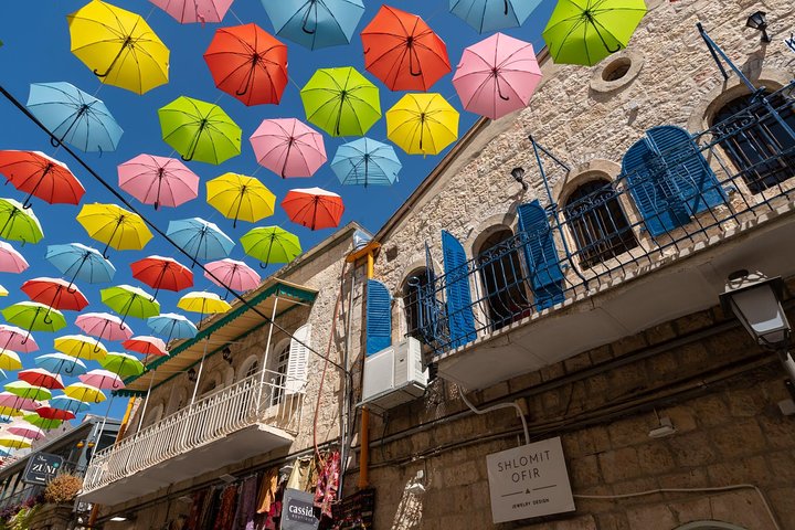 Colorful umbrellas above a Jerusalem Old City lane